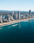 Aerial photograph of the Surfers Paradise skyline and beach on the Gold Coast, Queensland, with deep blue ocean and the Broadwater in the distance