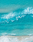 Top-down aerial view of turquoise water and white waves breaking over a sandbank at Surfers Paradise beach, Gold Coast