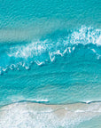 Top-down aerial view of turquoise water and white waves breaking over a sandbank at Surfers Paradise beach, Gold Coast