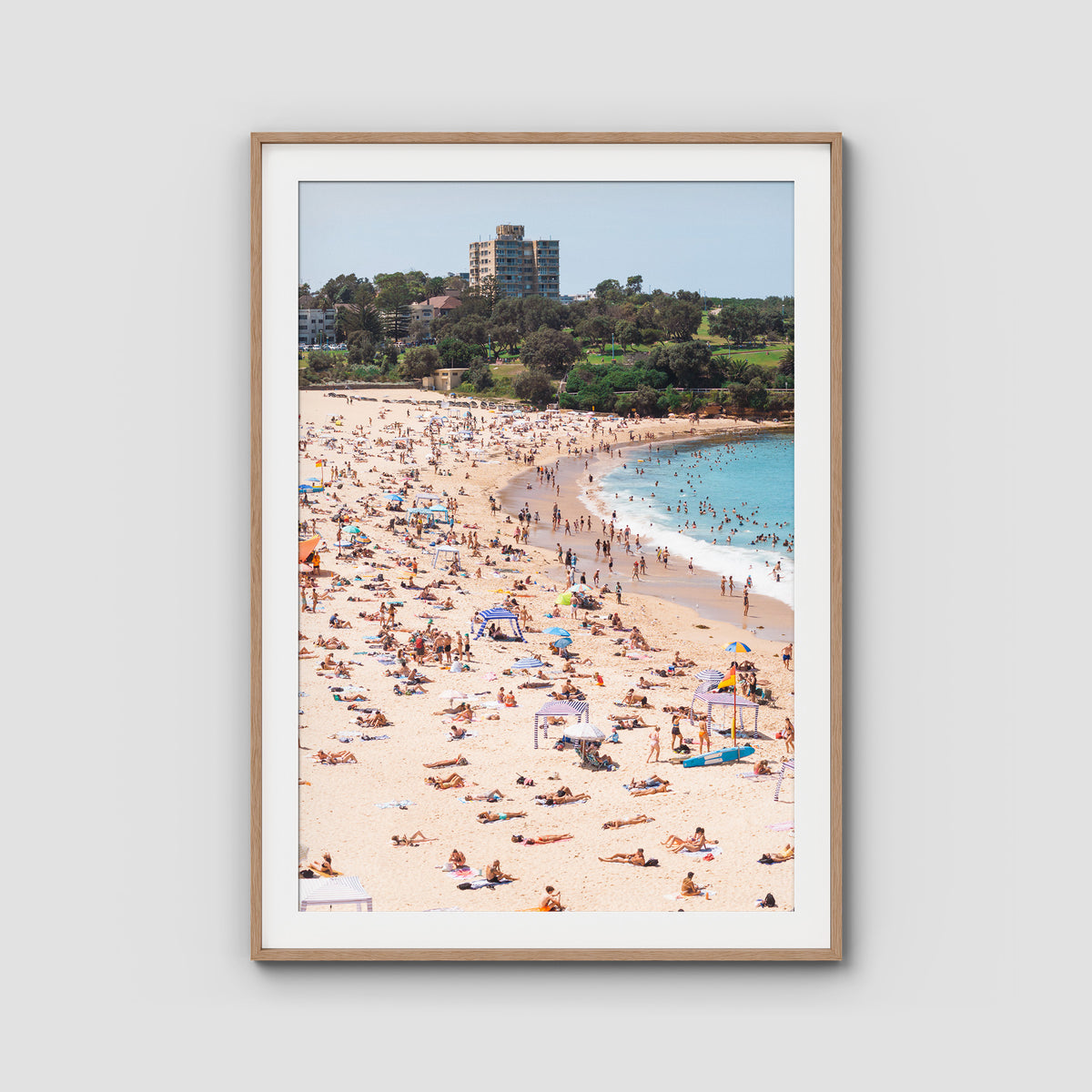 Coogee Beach – Summer in Motion Aerial Print - Traditional Frame - Raw Oak - Portrait