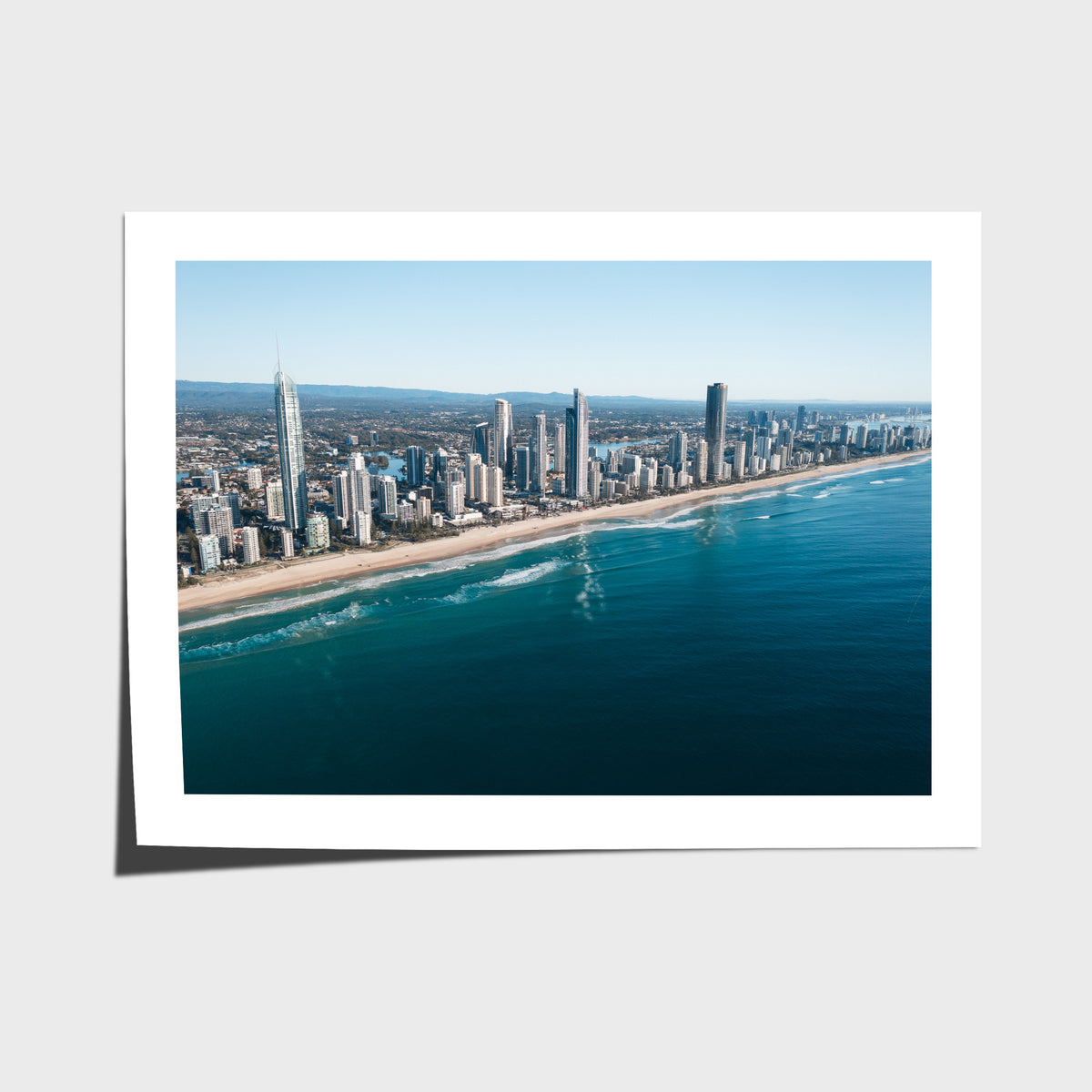 Aerial photograph of the Surfers Paradise skyline and beach on the Gold Coast, Queensland, with deep blue ocean and the Broadwater in the distance