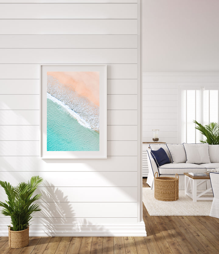 Framed beach photo on the wall